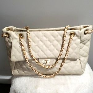 Cream faux leather purse.